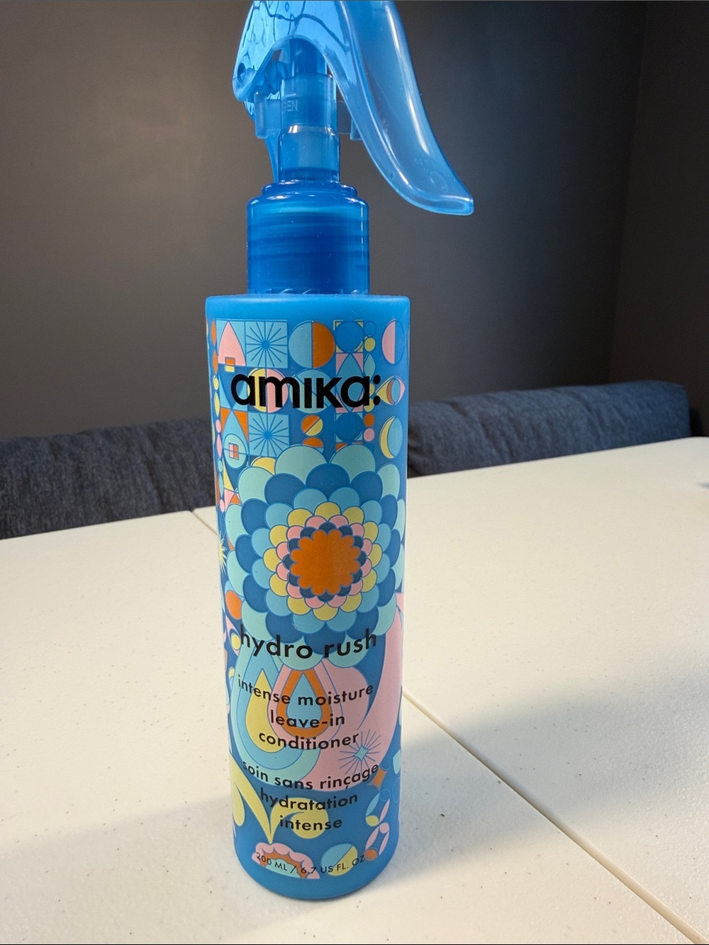 amika Hydro Rush Leave-In Conditioner Bottle in Blue with Multicolor Pattern